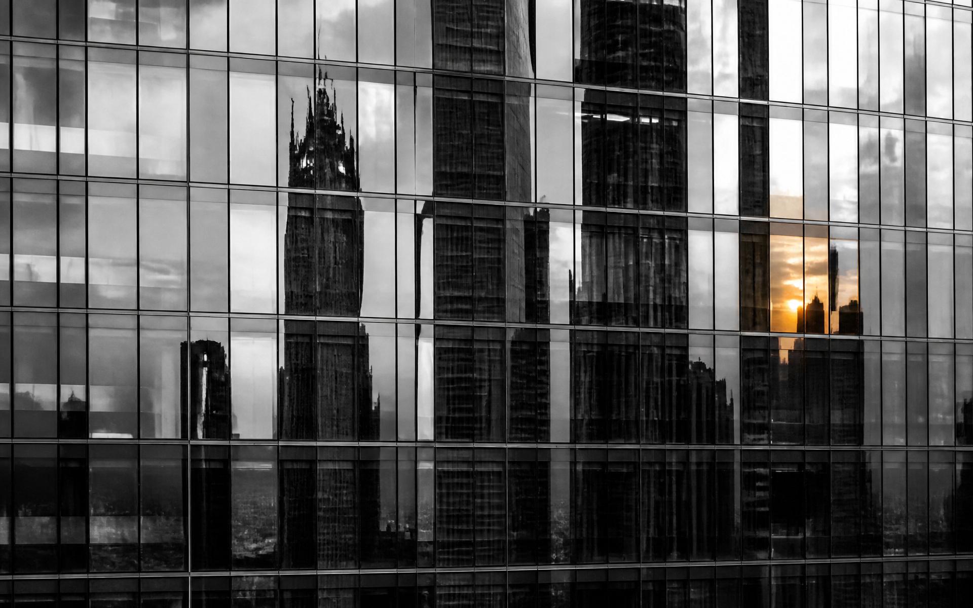 Glass curtain-wall facade at sunset